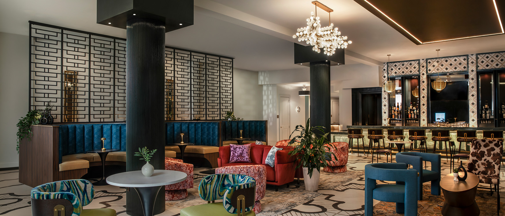 a room with a large chandelier and chairs