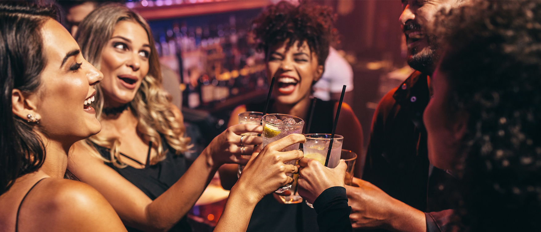 a group of people holding drinks