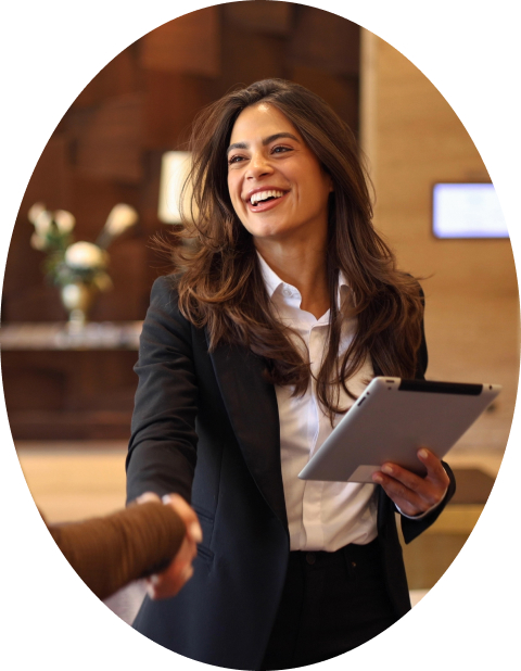 a woman holding a tablet and shaking hands