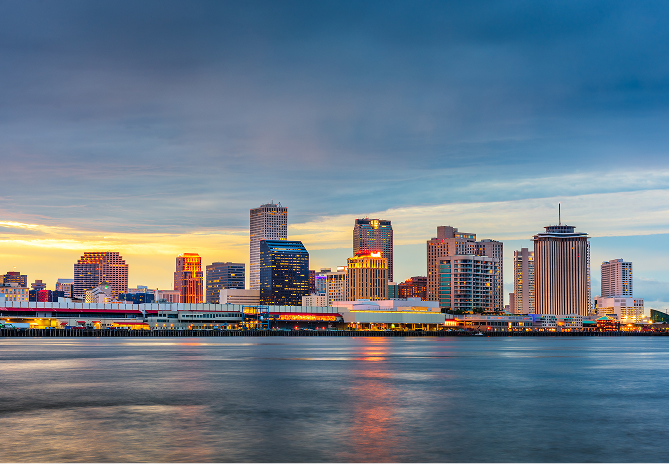 a city skyline with a body of water