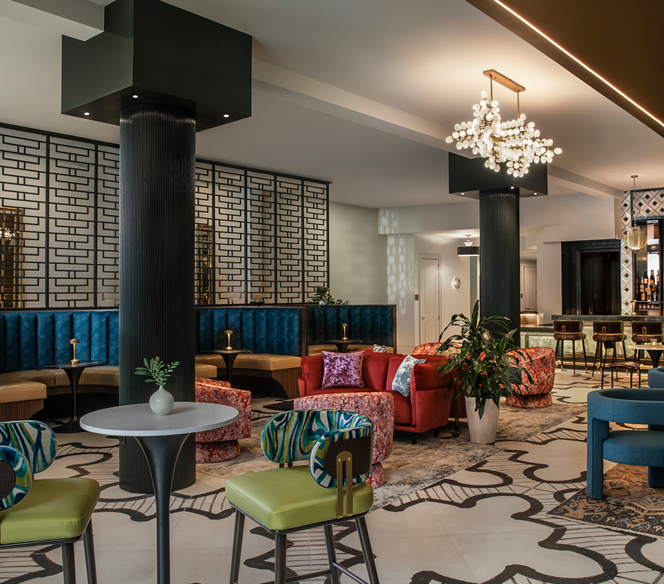 a room with colorful chairs and tables