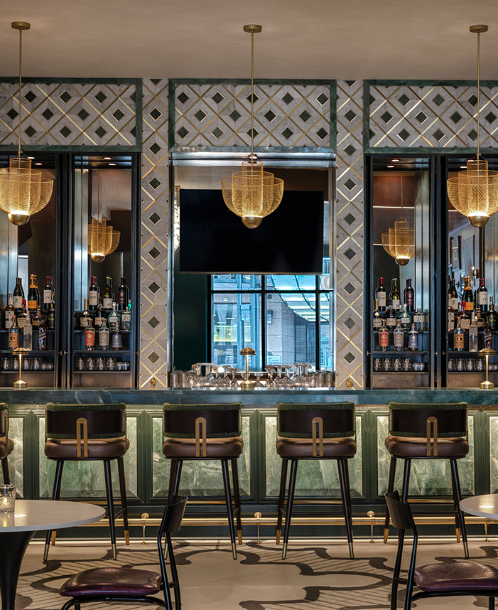 a bar with a counter and chairs