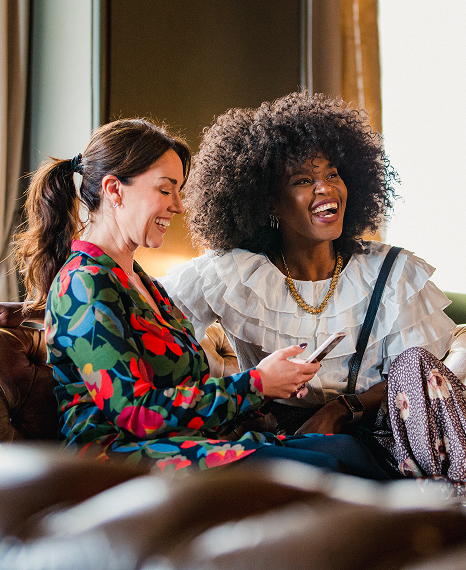 a group of women sitting on a couch