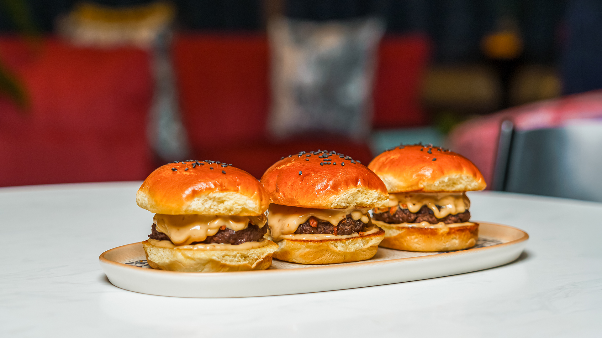 a plate of mini burgers