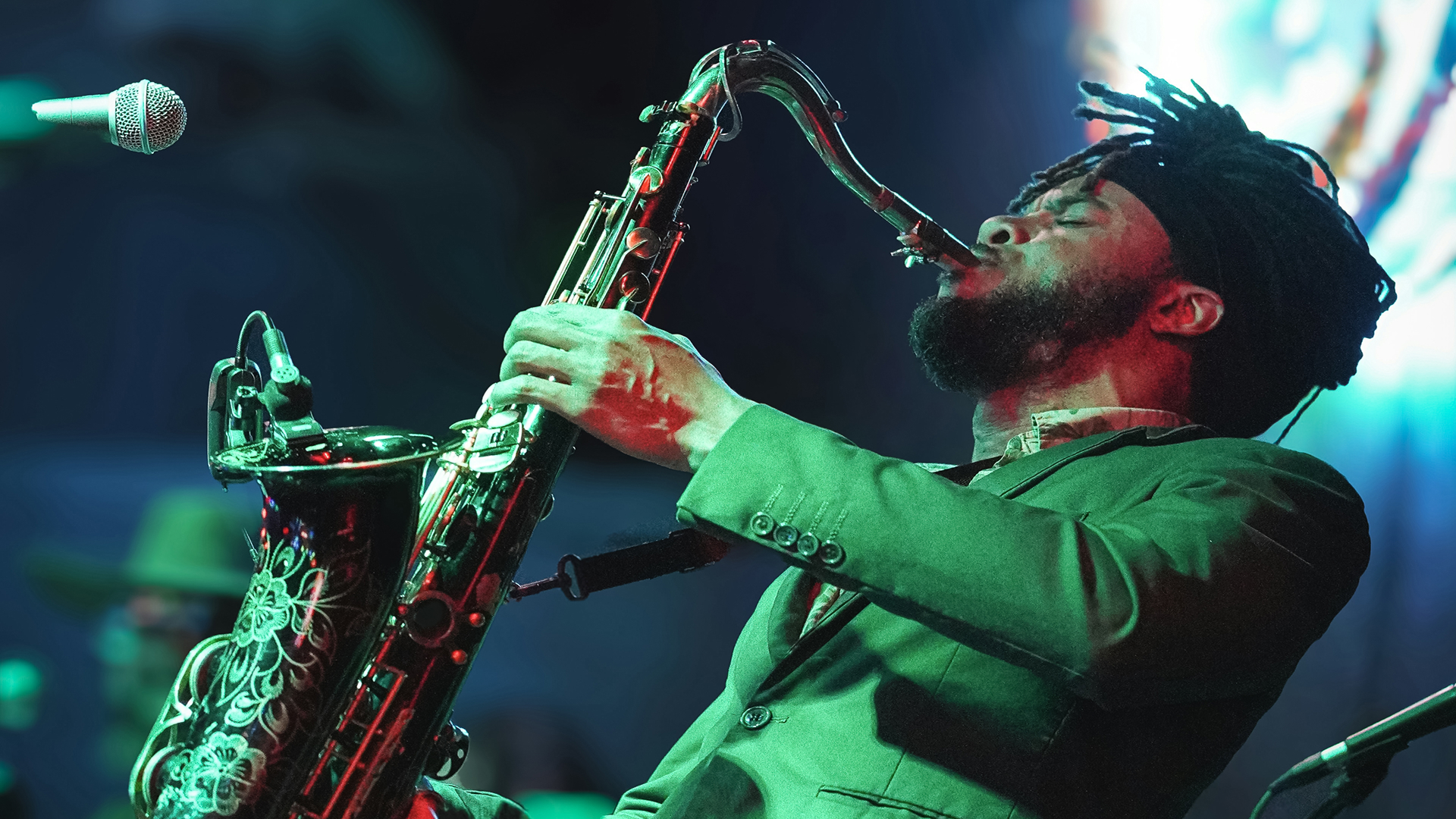 a man playing a saxophone