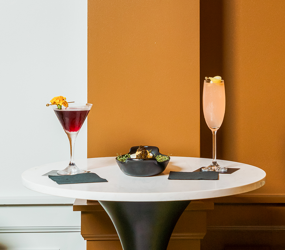 a table with a bowl of food and drinks on it
