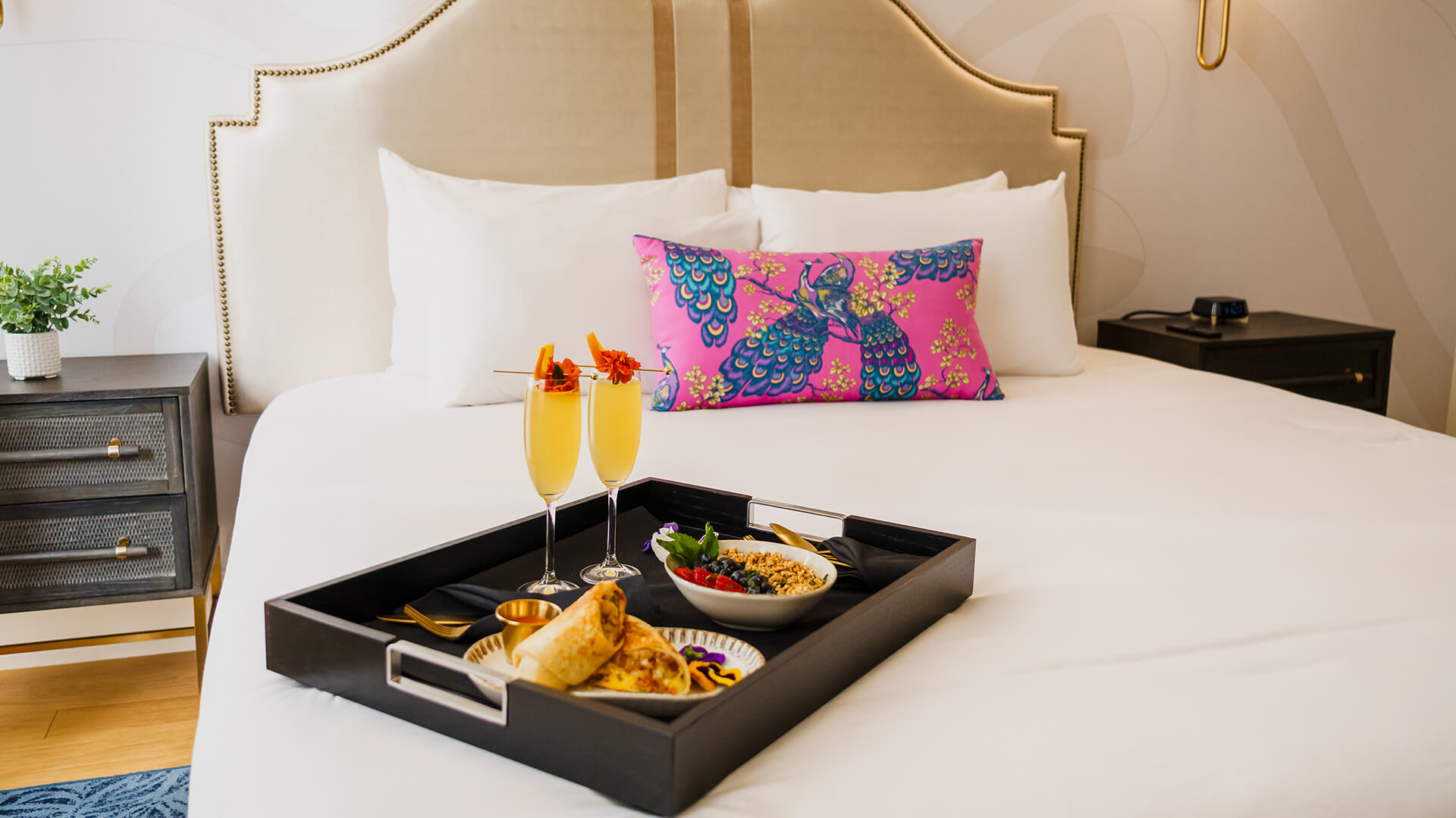 a tray of food on a bed