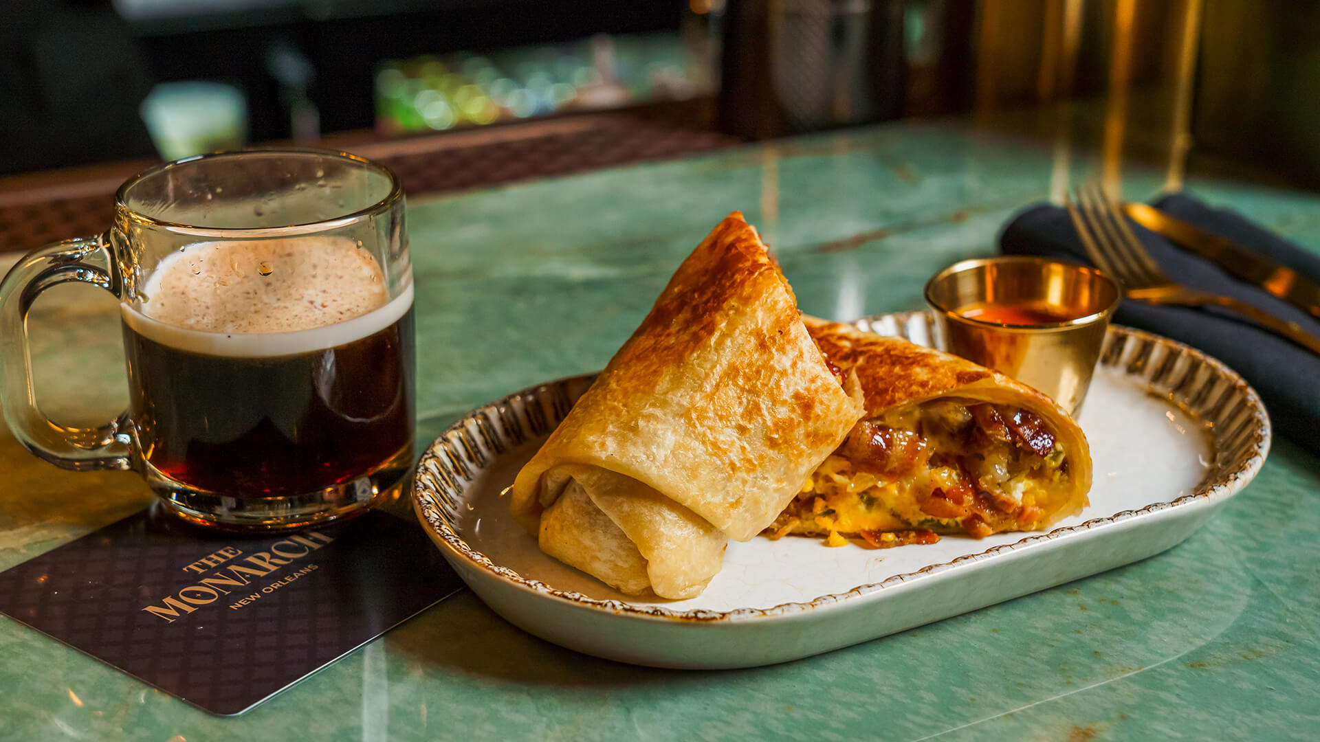 a burrito and a glass of beer
