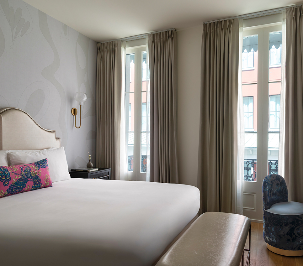 a bedroom with a bed and a chair