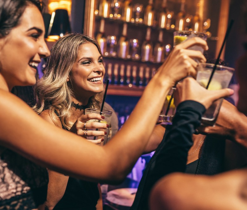 A group of women holding drinks