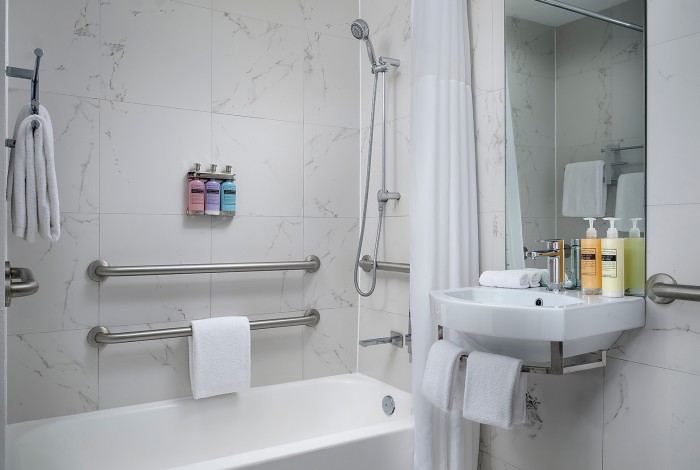 a bathroom with a sink and mirror