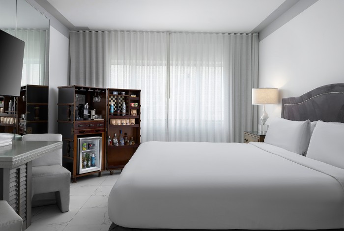 a room with a bed and a desk