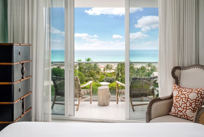 a bedroom with a balcony