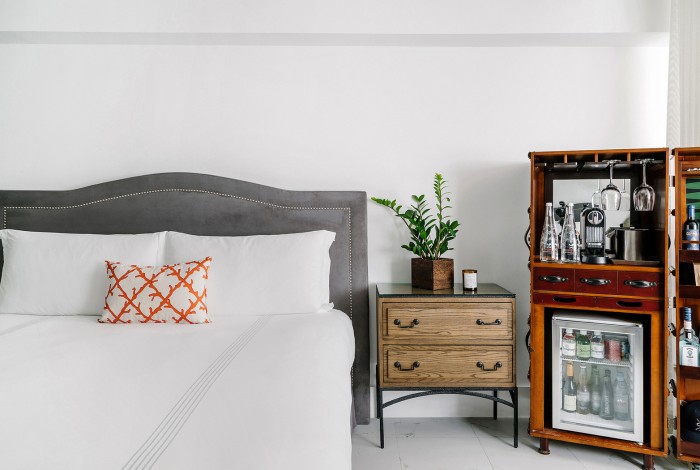 a bedroom with a large bed and a tv