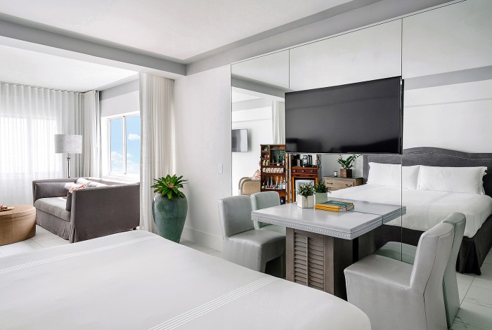 a bedroom with a bed and table