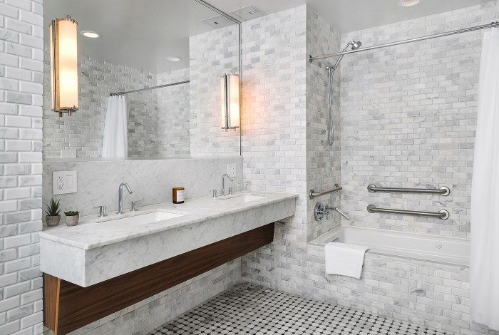 a bathroom with a countertop sink and a shower unit