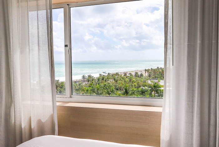 a bedroom with a large window