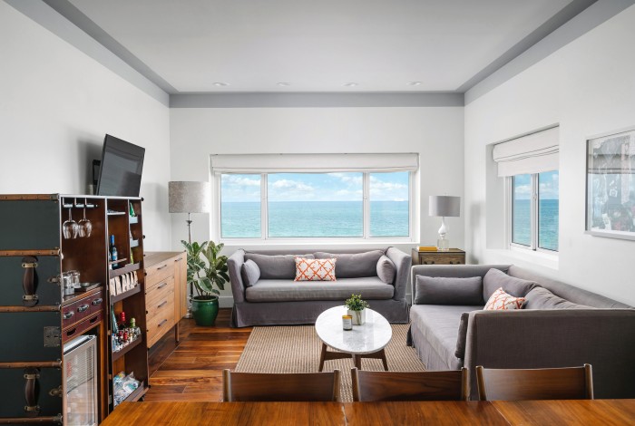 a window with a view of the ocean and a beach