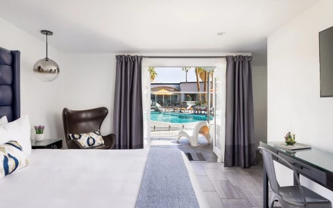 a bedroom with a large window