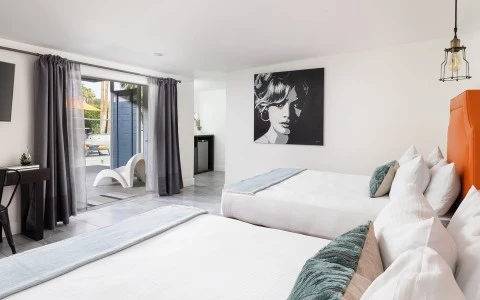 a bedroom with a large glass door