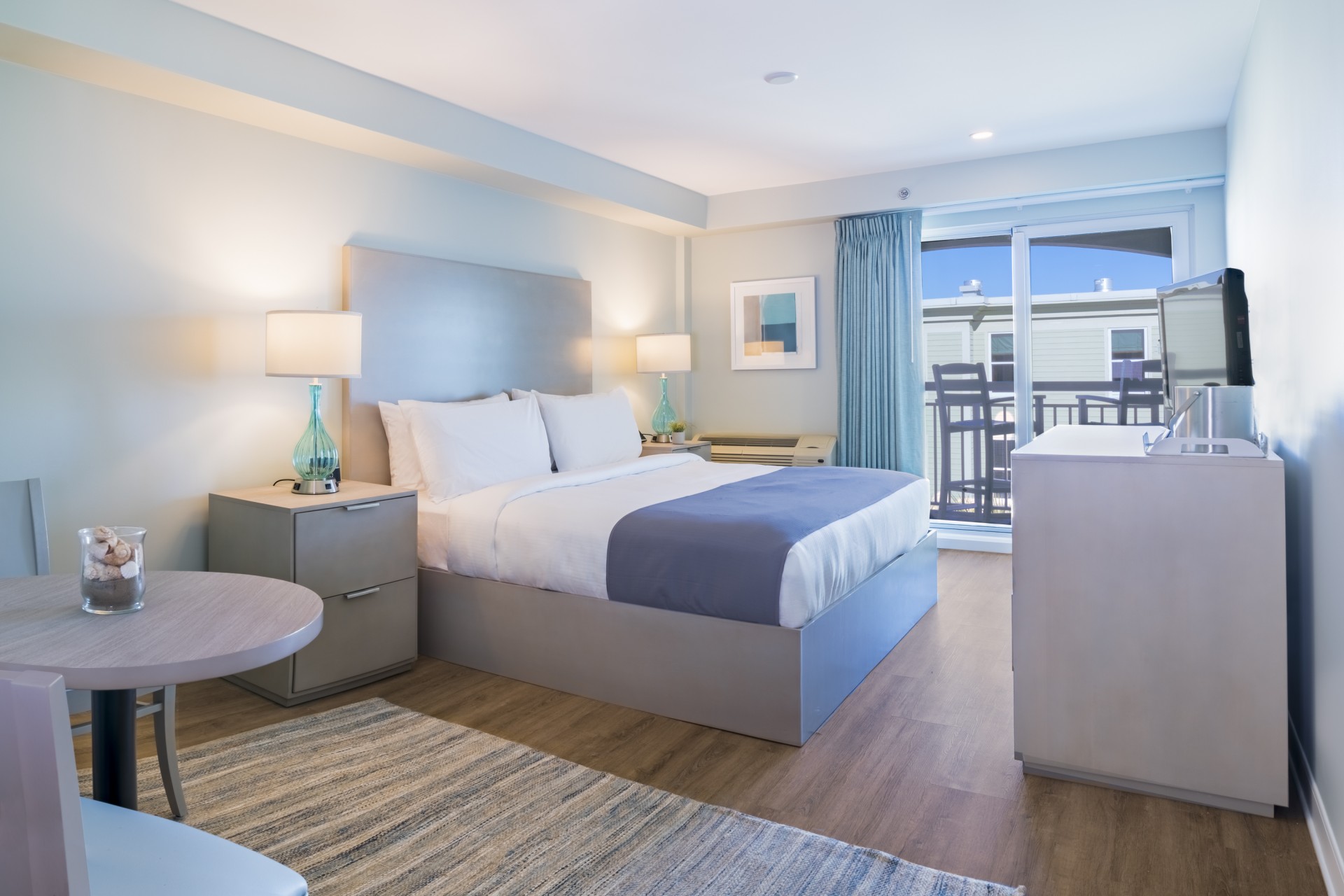 a bedroom with a bed and a table