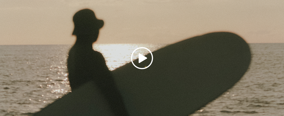 a person standing on a surfboard