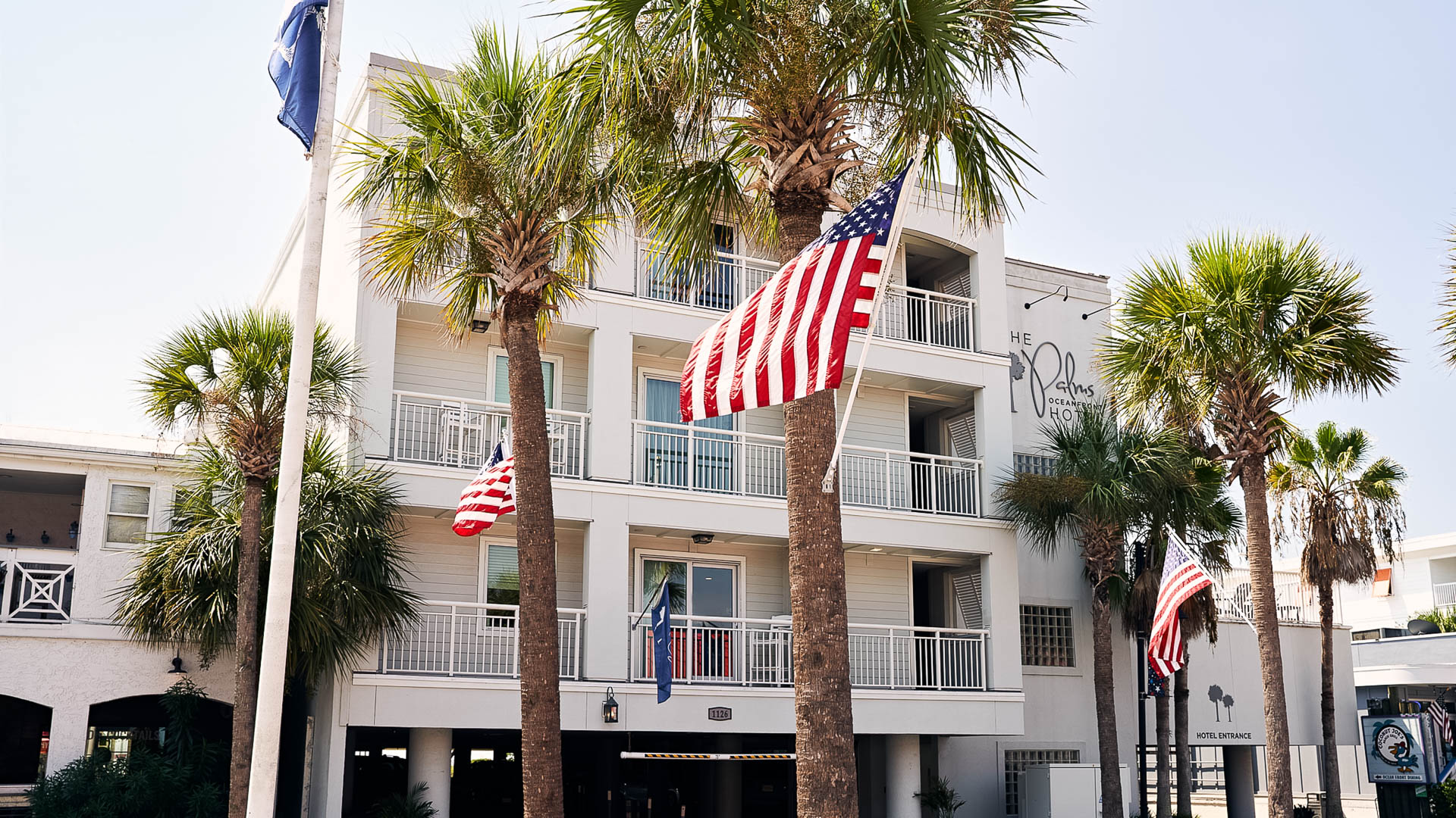 a flag on a pole in front of a building