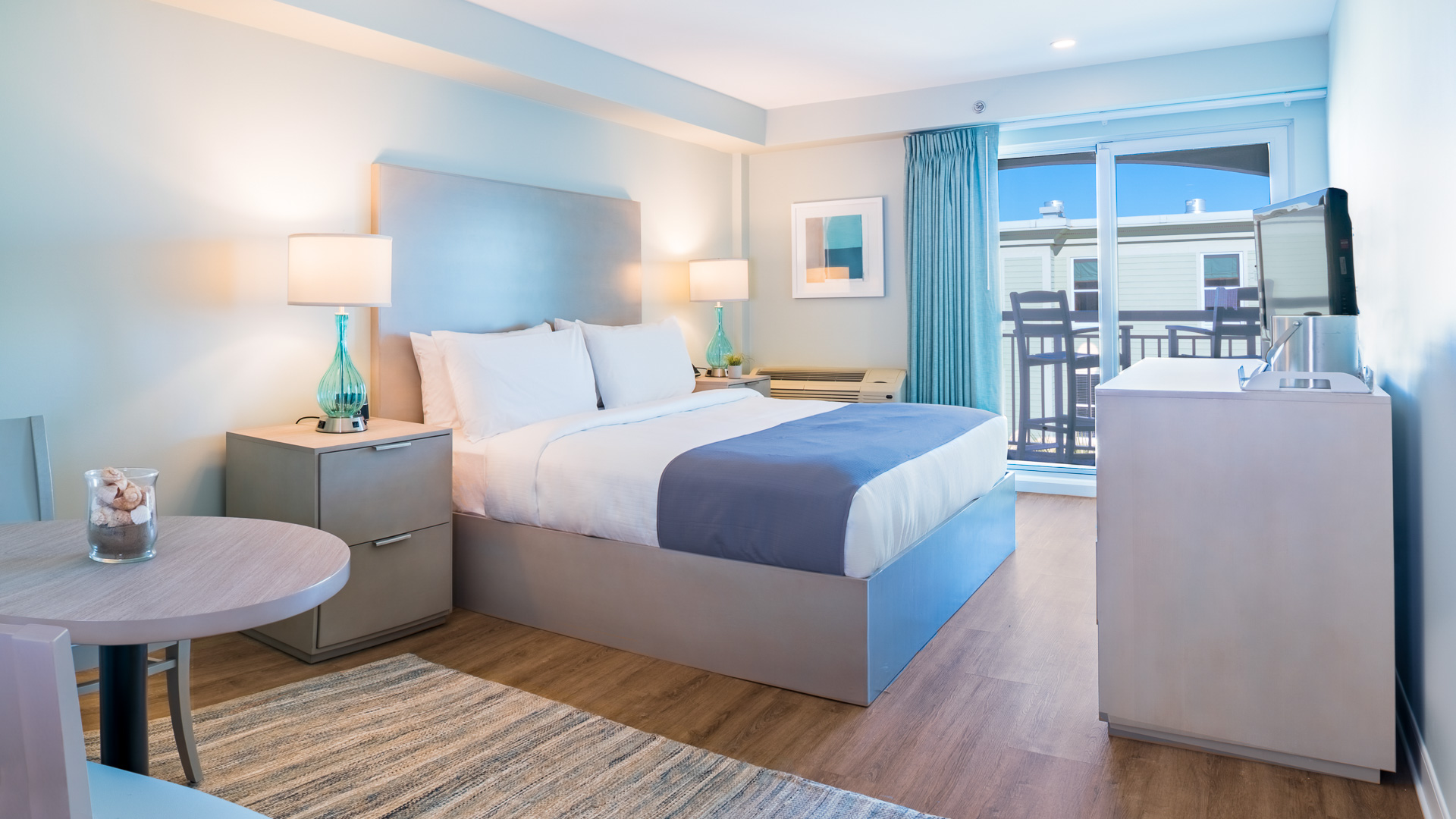 a bedroom with a bed and a table