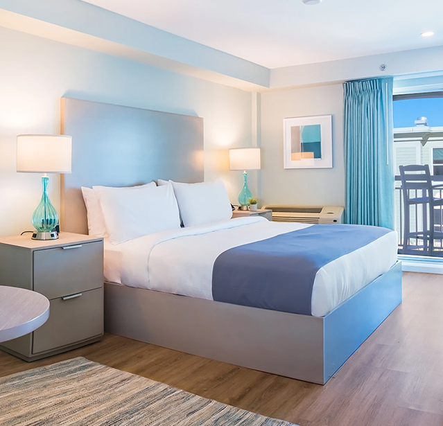 a bedroom with a bed and a table