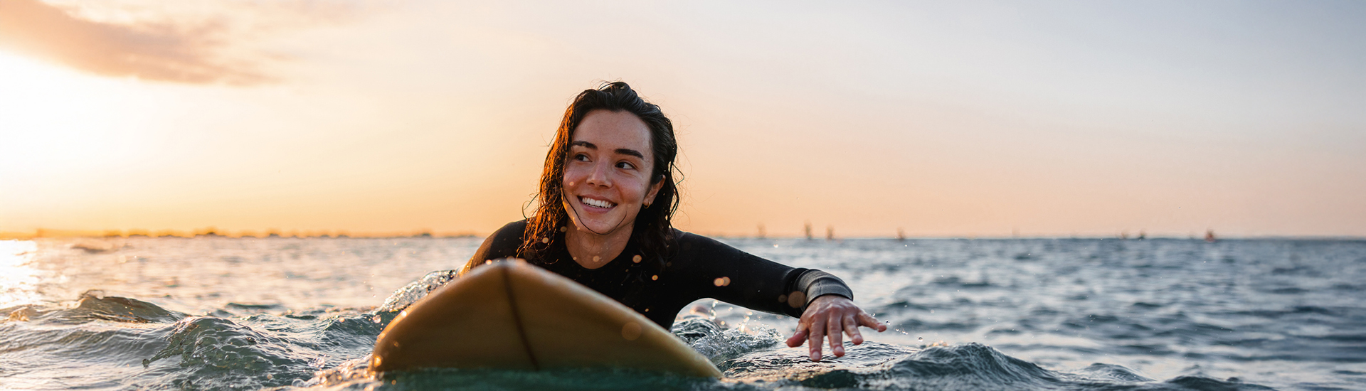 a woman on a surfboard in the water