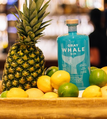 a pineapple and lemons on a tray