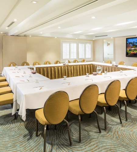 a room with a large table and chairs