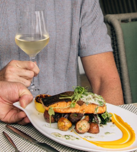 a person holding a glass of wine