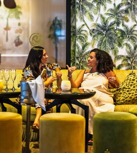 two women sitting at a table