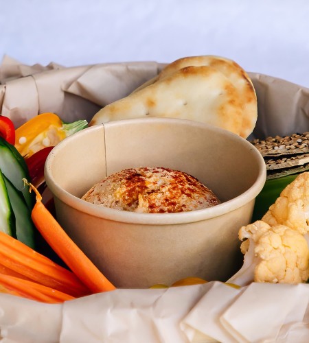 a bowl of food in a paper bag