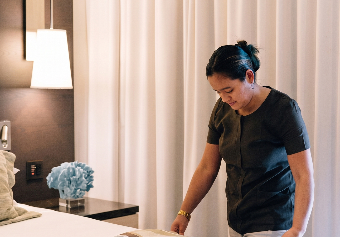 a woman standing in front of a table
