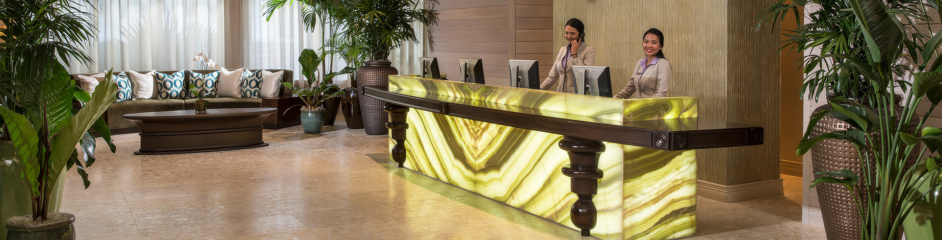 a woman talking on the phone at a reception desk
