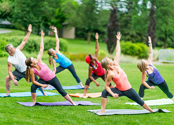a group of women doing yoga on mats