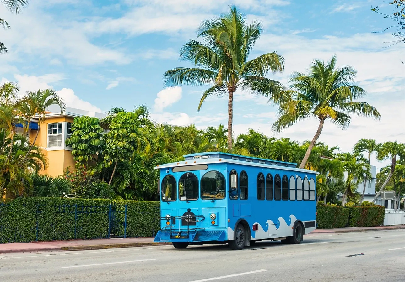 a blue trolley on the street