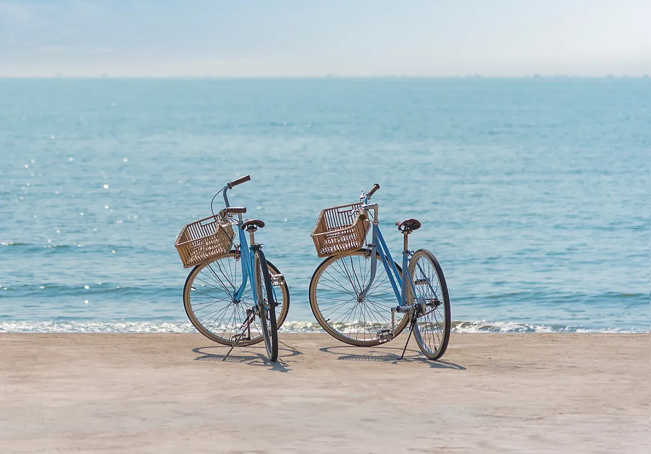 two bicycles on a beach