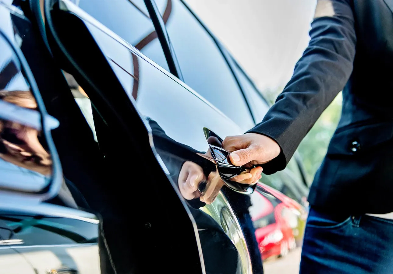 a person opening a car door