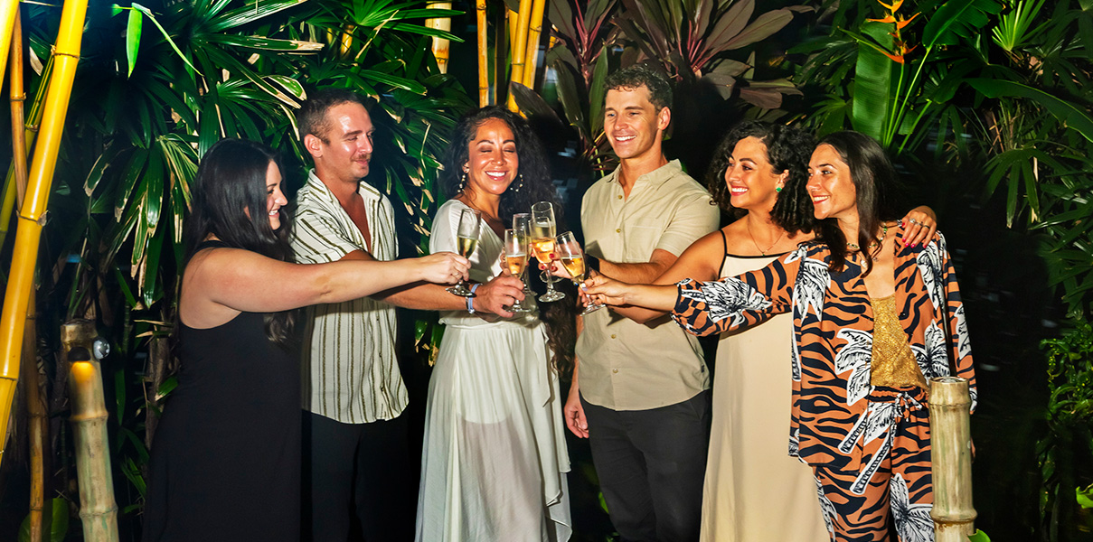 a group of people clinking glasses