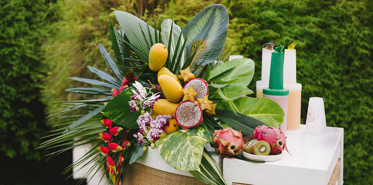 a group of tropical fruits and flowers
