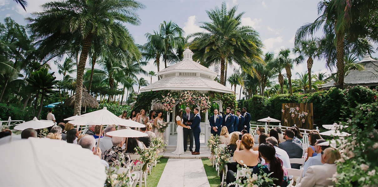 a group of people standing under a gazebo