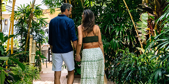 a man and woman holding hands