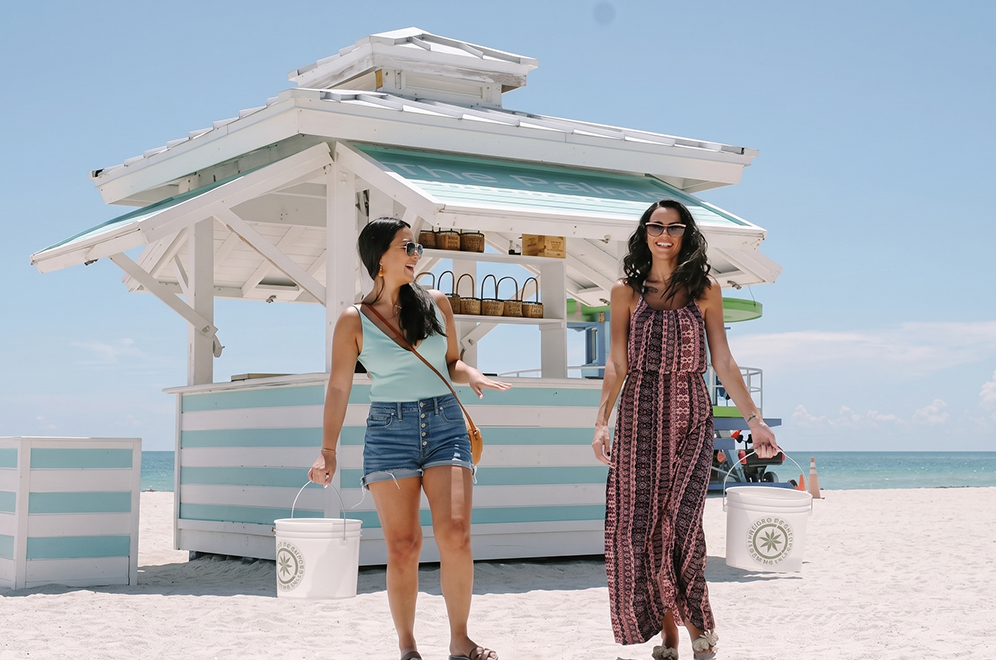 two women walking on the beach