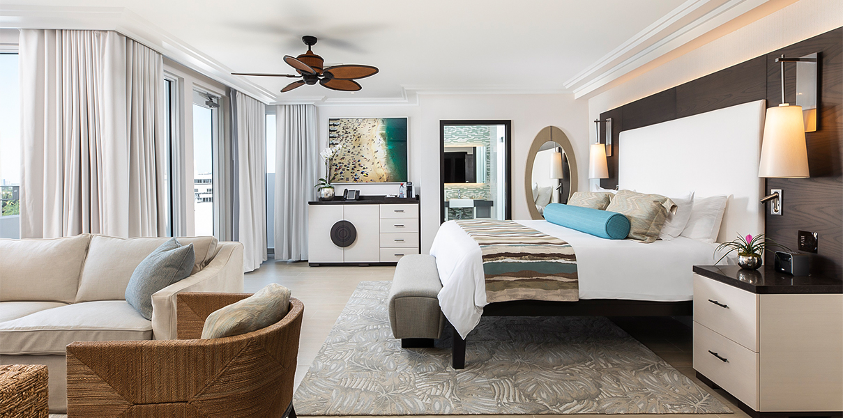 a bedroom with a bed and a fan