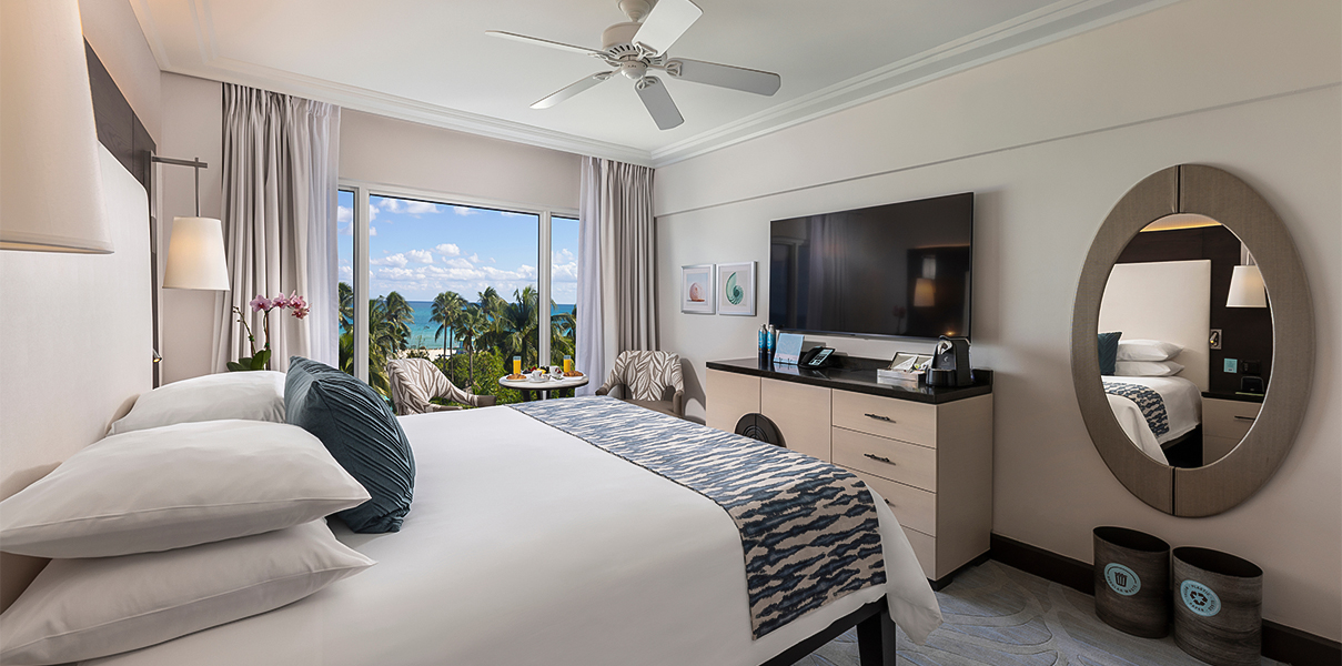 a room with a large bed and a television