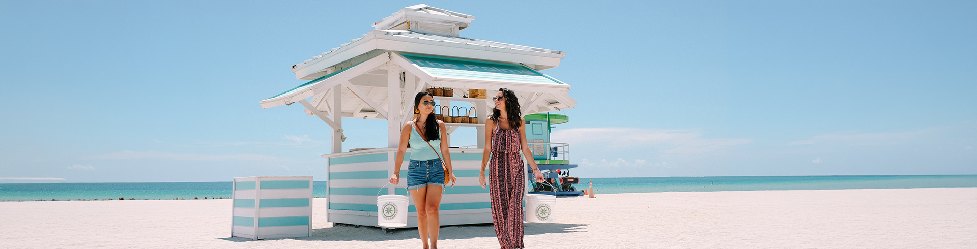 two women walking on a beach