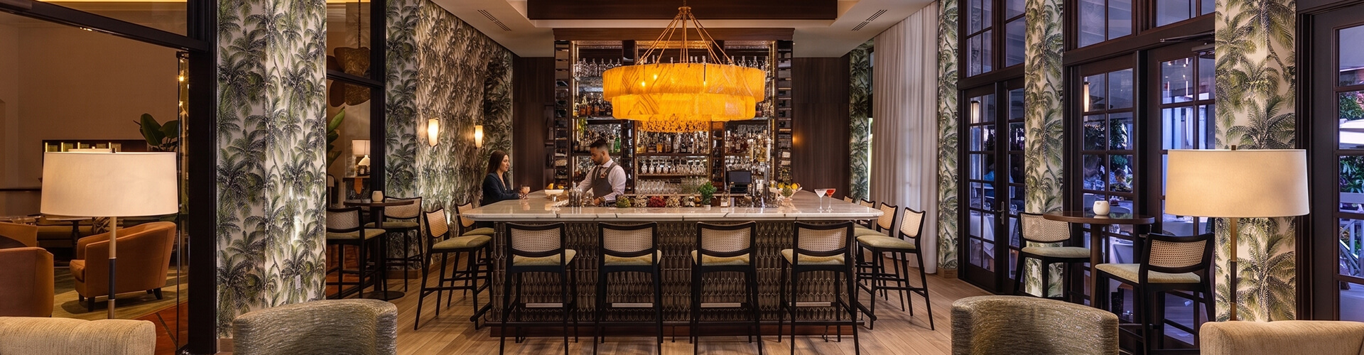 a bar with a bar and a man behind it